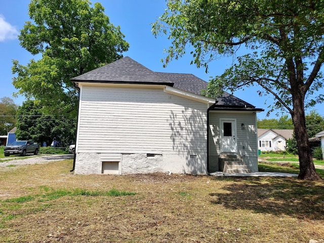 view of home's exterior featuring a lawn