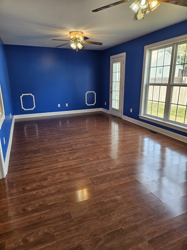 unfurnished room featuring dark hardwood / wood-style flooring