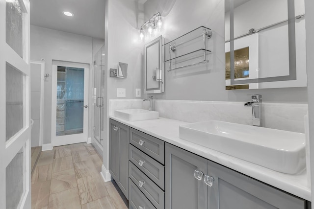 bathroom with vanity and walk in shower