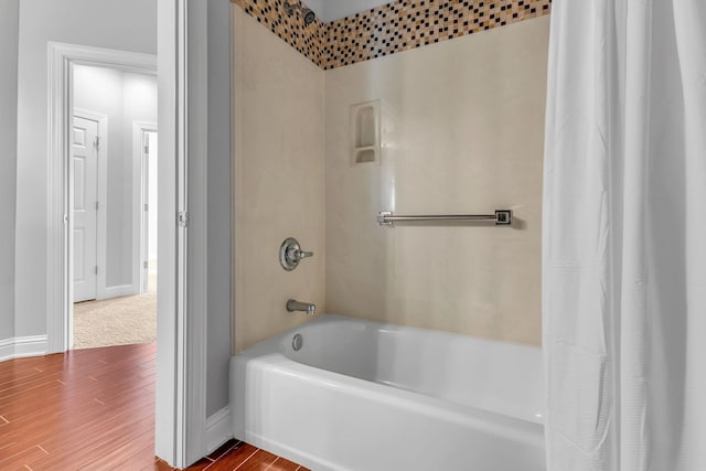 bathroom with shower / tub combo with curtain