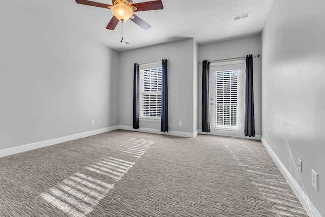 carpeted empty room with ceiling fan