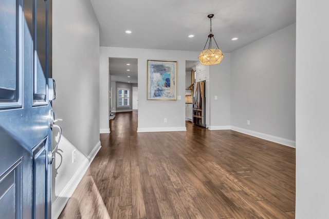 entryway with dark wood-type flooring