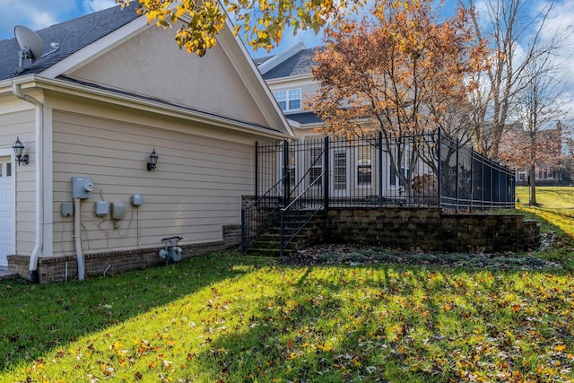 back of house featuring a yard