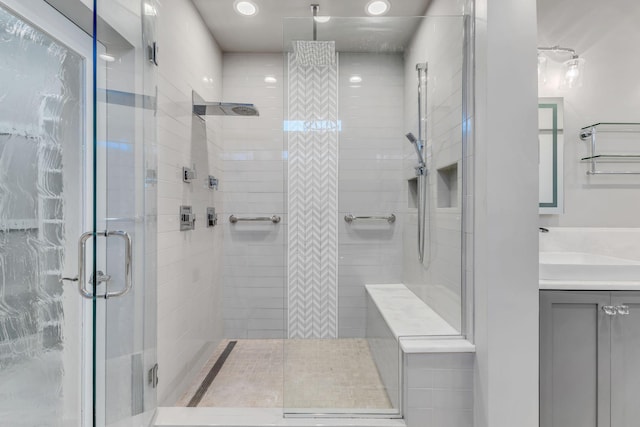 bathroom with vanity and walk in shower