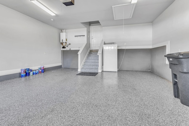 interior space featuring a garage door opener and water heater