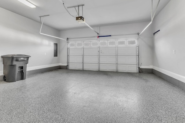 garage featuring a garage door opener and electric panel