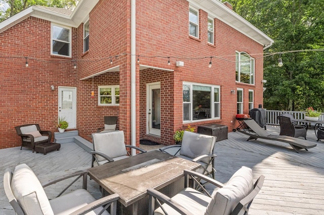 back of house with a wooden deck