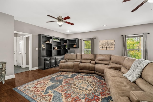 living room with plenty of natural light and dark hardwood / wood-style floors