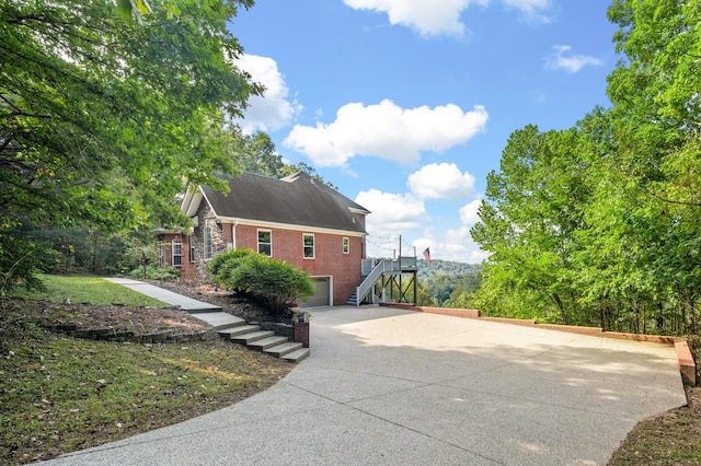 view of side of property featuring a garage