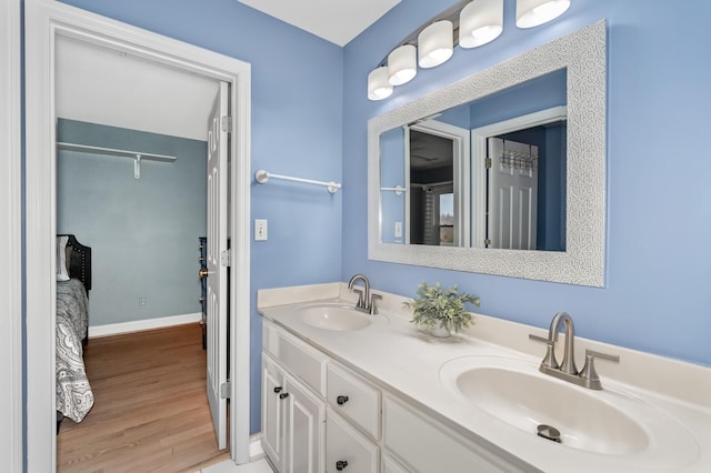 bathroom featuring hardwood / wood-style flooring and vanity