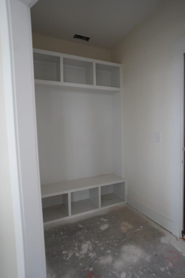 mudroom with concrete flooring