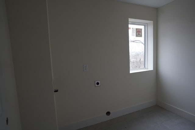 laundry room featuring hookup for an electric dryer and tile patterned floors