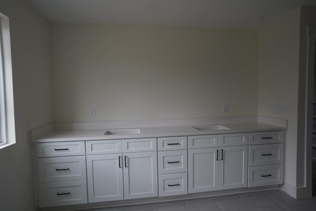 bathroom featuring tile patterned flooring and vanity