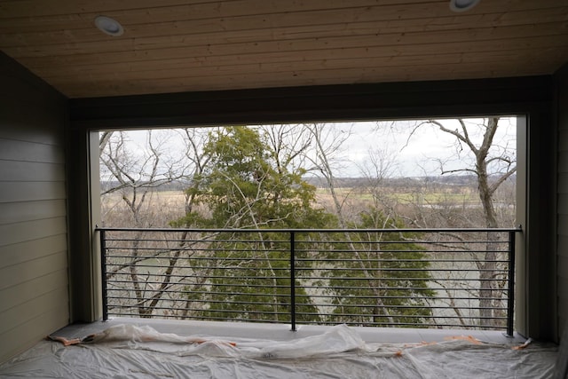 view of patio / terrace featuring a balcony and a rural view