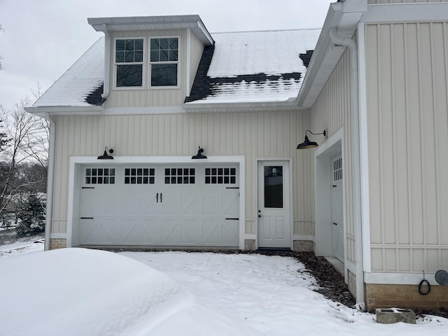 view of snow covered garage