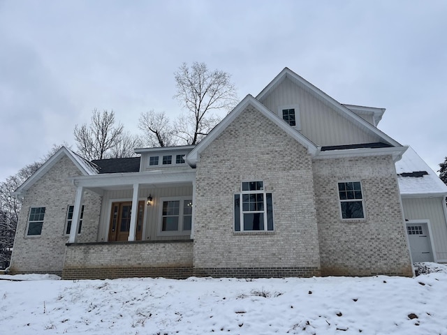 view of snow covered house