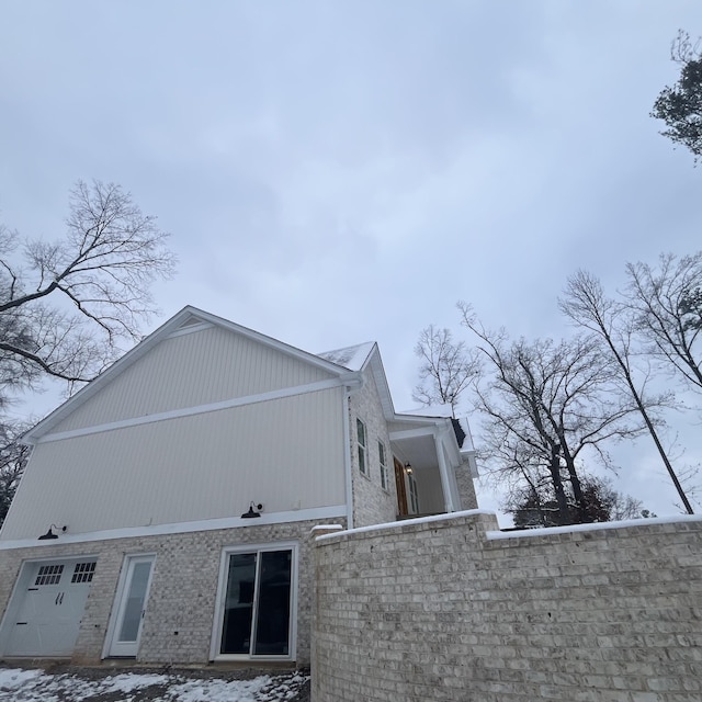 view of side of property with a garage