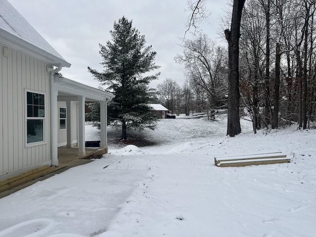 view of yard layered in snow