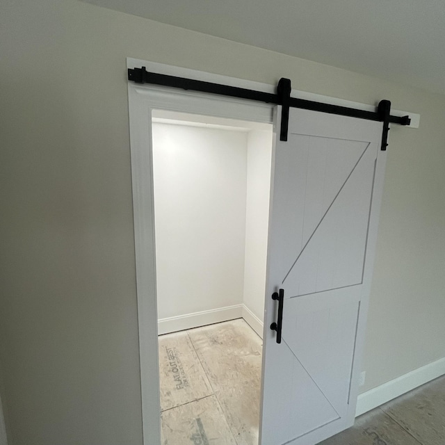 room details with a barn door and concrete floors