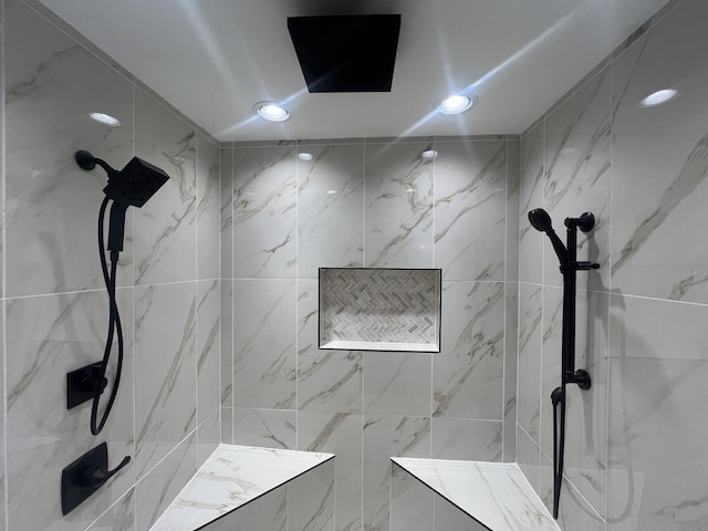 bathroom with tiled shower