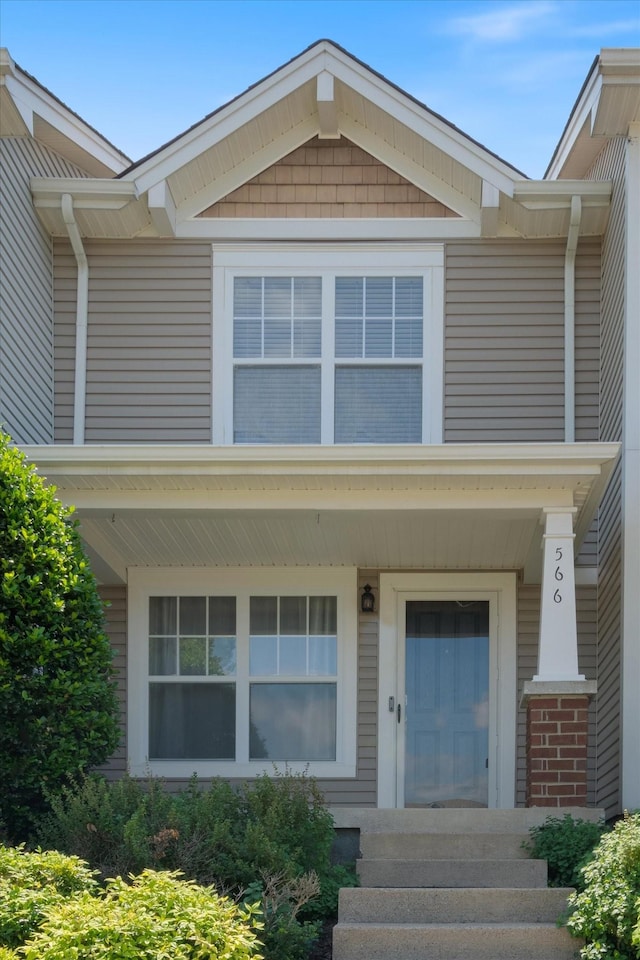 entrance to property featuring a porch