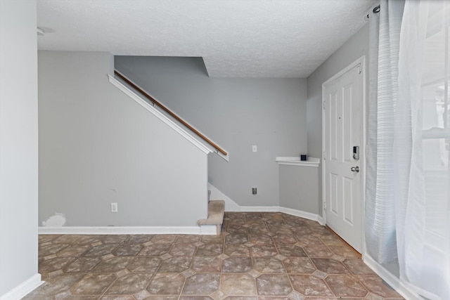 entrance foyer with a textured ceiling