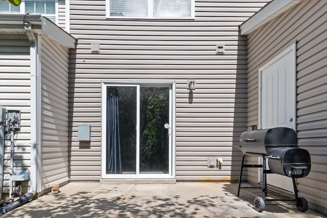 property entrance with a patio