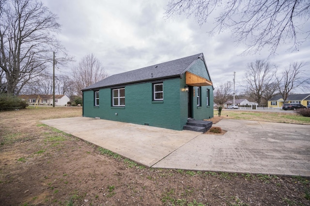 view of side of home featuring a patio