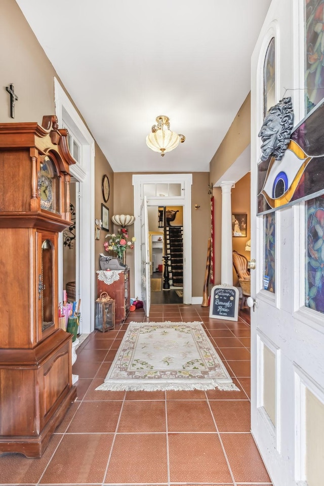 tiled foyer with decorative columns