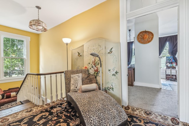 carpeted bedroom featuring a crib