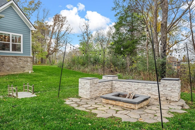 view of yard with an outdoor fire pit