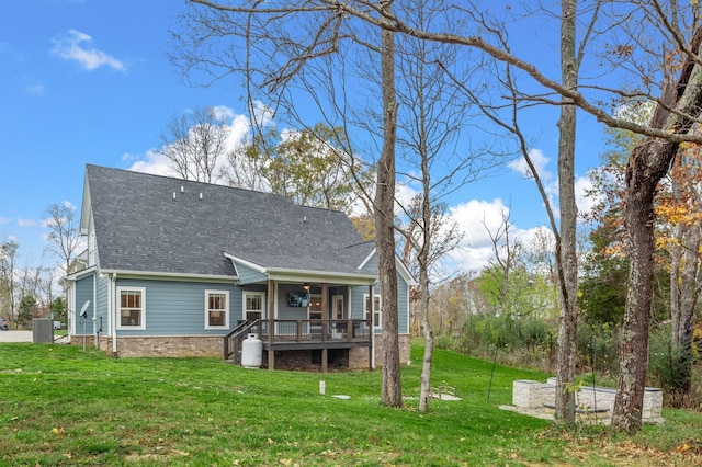 rear view of house with a lawn