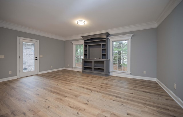 unfurnished living room featuring light hardwood / wood-style flooring and ornamental molding