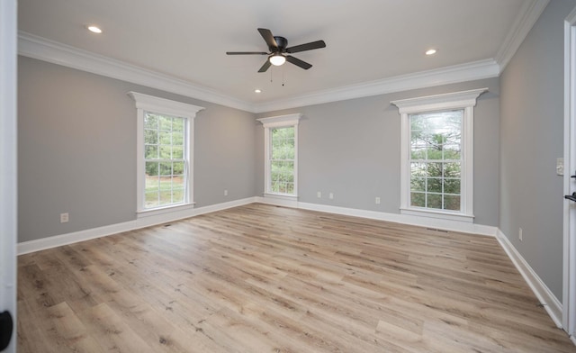 empty room featuring light wood-type flooring, ceiling fan, and crown molding