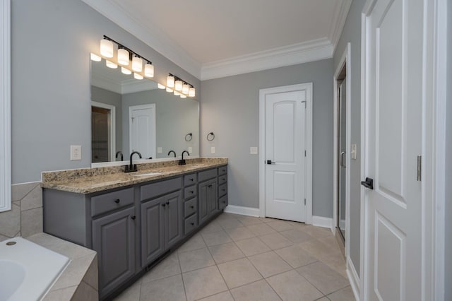 bathroom with tile patterned flooring, a bath, vanity, and crown molding