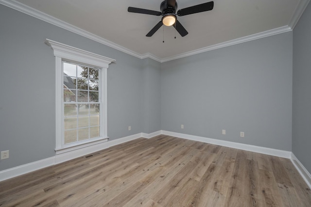 spare room with crown molding, light hardwood / wood-style flooring, and ceiling fan