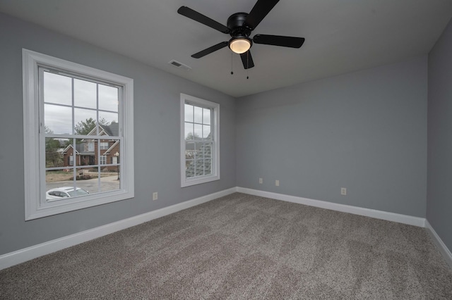 carpeted empty room with ceiling fan