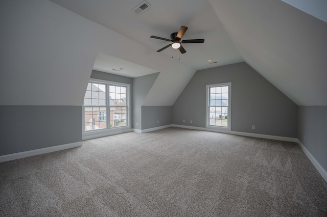 bonus room with carpet flooring, ceiling fan, plenty of natural light, and vaulted ceiling