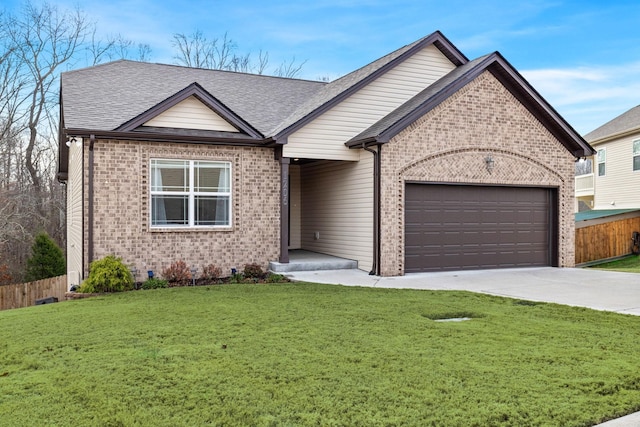 view of front of house featuring a garage and a front lawn