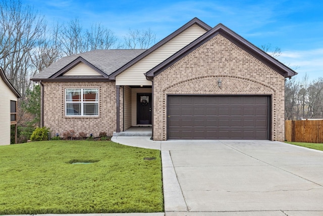 view of front of house featuring a garage and a front yard