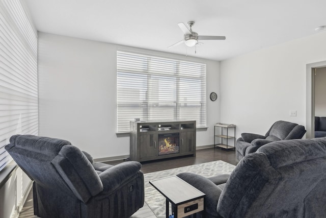 living room featuring dark hardwood / wood-style floors and ceiling fan