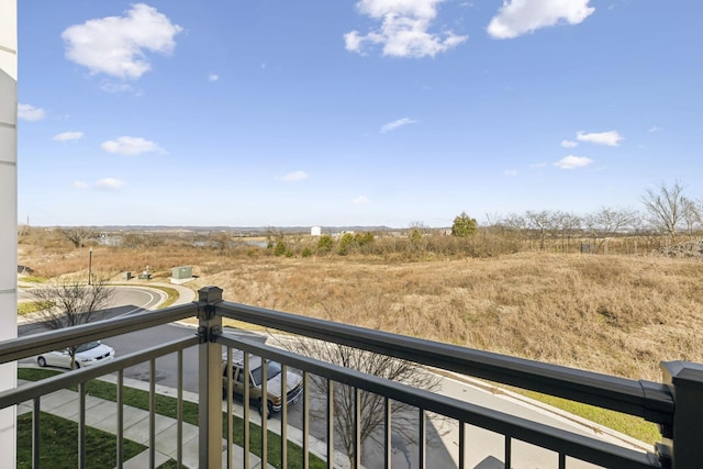 balcony featuring a rural view