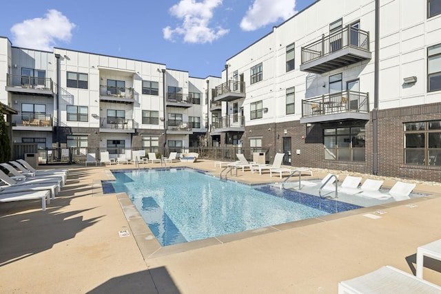 view of swimming pool with a patio