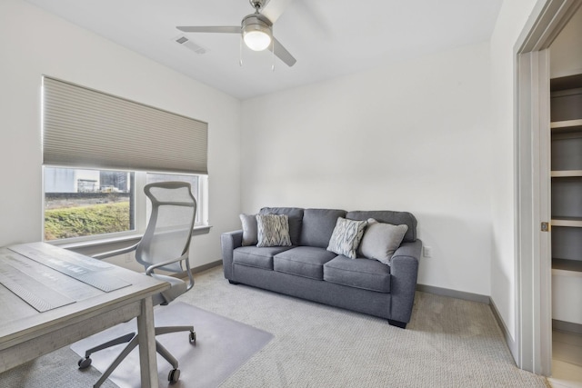 office featuring light colored carpet and ceiling fan