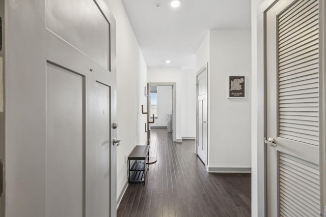 hallway featuring dark hardwood / wood-style flooring