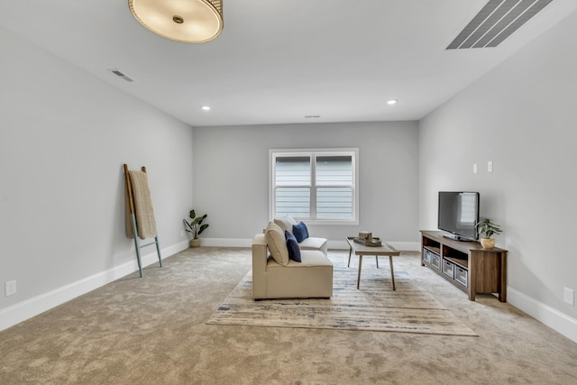 unfurnished living room featuring light carpet