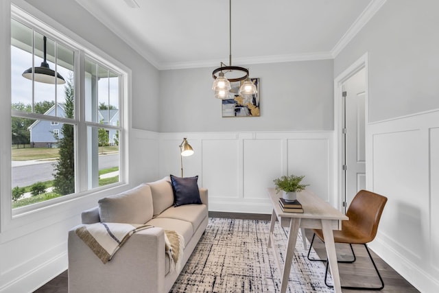 living area with dark hardwood / wood-style flooring and ornamental molding