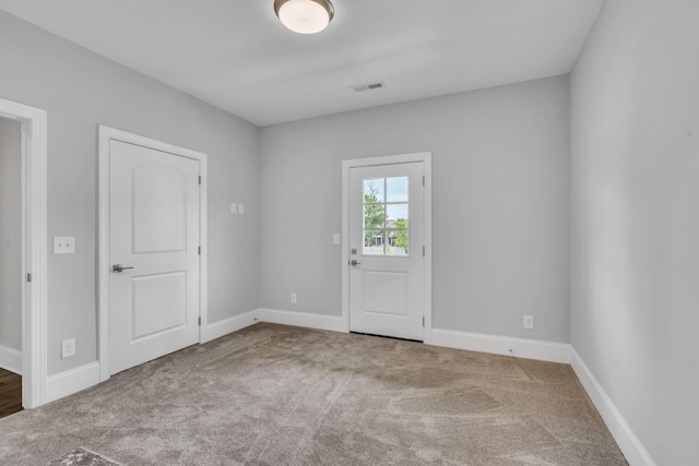 empty room featuring carpet flooring