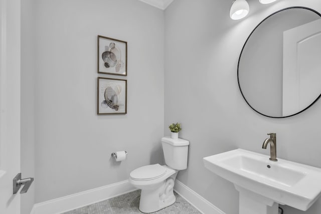 bathroom featuring tile patterned floors, sink, and toilet