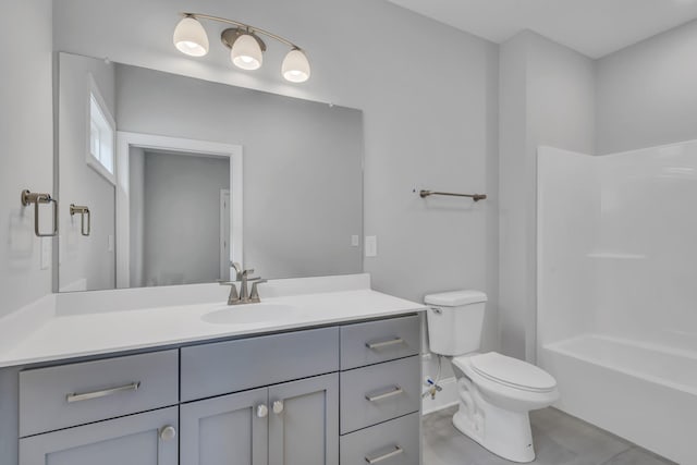 bathroom featuring tile patterned flooring, vanity, and toilet